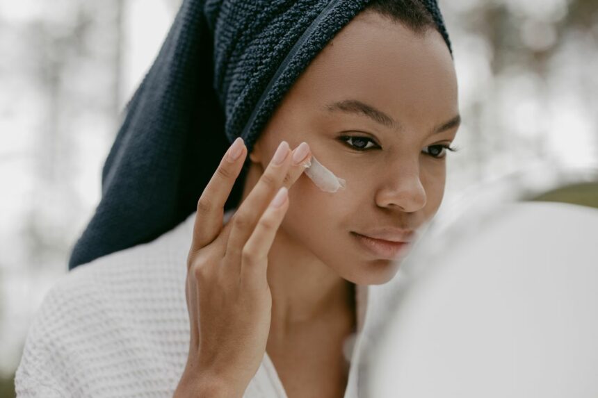 RETINOL Black woman applying a Retinol cream