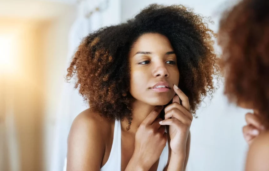 hyaluronic-acid-free-korean-skincare-sensitive-skin-barrier-repair Woman examining sensitive facial skin before using Hyaluronic acid-free Korean skincare