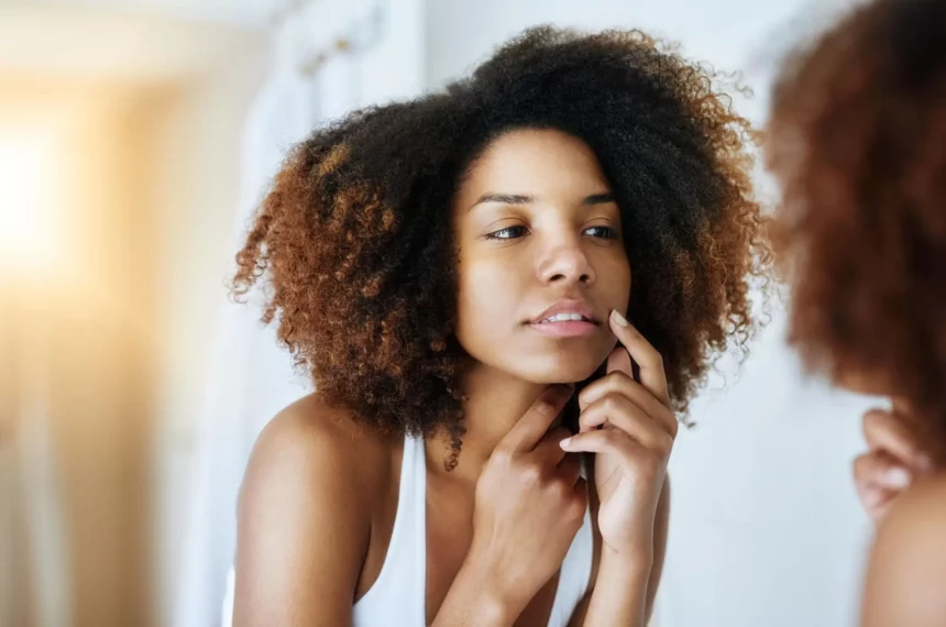 hyaluronic-acid-free-korean-skincare-sensitive-skin-barrier-repair Woman examining sensitive facial skin before using Hyaluronic acid-free Korean skincare