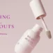 Minimal skincare bottle with soft pink background illustrating the difference between skin purging and acne breakouts.